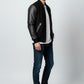 Scarlett Stitch Men's black bomber jacket with genuine leather sleeves, ribbed collar, cuffs, and hem.