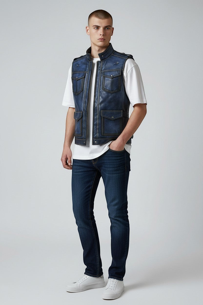 Model wearing a Scarlett Stitch distressed blue leather utility vest with snap-button pockets and a stand-up collar.
