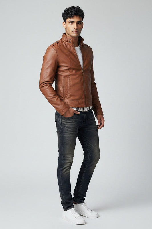 Model wearing a brown Scarlett Stitch faux leather jacket with a stand collar, white t-shirt, and dark denim jeans.