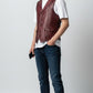 Scarlett Stitch men's burgundy leather vest with lapel collar, button front, flap pockets, and adjustable back belt.