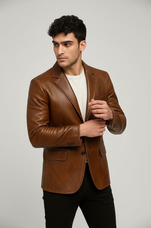 Man wearing a Scarlett Stitch cognac brown leather blazer with notch lapels and a single-button closure.