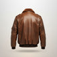 Scarlett Stitch Men's distressed brown faux leather bomber jacket with shearling collar and ribbed cuffs.