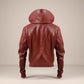 Scarlett Stitch men's burgundy leather hooded bomber jacket with quilted shoulders and ribbed cuffs.