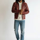 Scarlett Stitch Men's hooded leather bomber jacket in burgundy with quilted shoulders and ribbed cuffs.