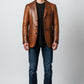 Scarlett Stitch Men's Genuine Leather Blazer Jacket in warm brown, featuring a notched lapel, three-button closure, and chest pocket.