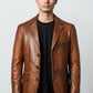 Scarlett Stitch Men's genuine leather blazer jacket in warm brown with notched lapel and three-button closure.