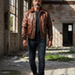 Scarlett Stitch Men's classic brown leather bomber jacket with ribbed collar, cuffs, and hem. Features zip front and chest pockets.