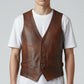 Scarlett Stitch Men's distressed brown leather vest with V-neck, button front, and flap pockets.