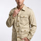 Scarlett Stitch Men's beige cotton blend safari utility jacket with multiple flap pockets and epaulets.