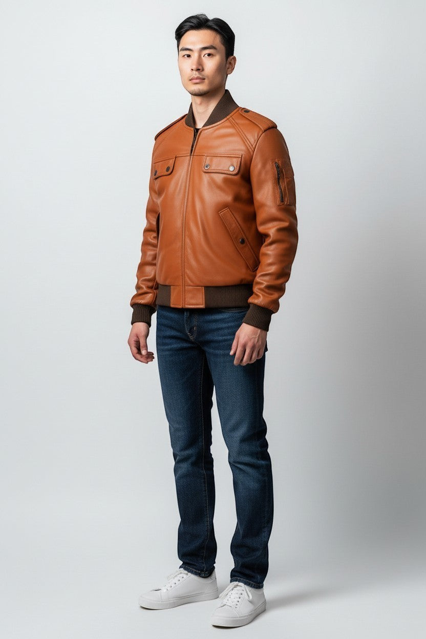 Scarlett Stitch Men's tan faux leather bomber jacket with ribbed collar, cuffs, hem, and dual chest pockets.