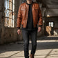Scarlett Stitch Men's tan genuine leather bomber jacket with ribbed collar, cuffs, hem, zip front, and snap chest pockets.