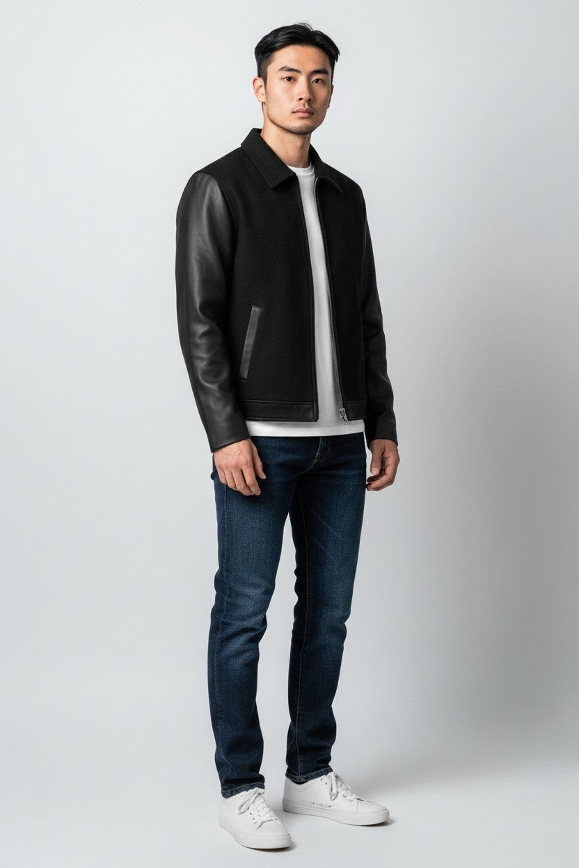Scarlett Stitch Men's black wool bomber jacket with faux leather sleeves, zip front, and welt pockets.