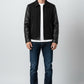 Scarlett Stitch Men's black wool blend bomber jacket with faux leather sleeves, zip front, and welt pockets.