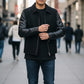 Scarlett Stitch Men's black wool blend bomber jacket with faux leather sleeves, zip front, and welt pockets.
