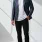 Scarlett Stitch Men's navy blue faux leather blazer with silver stud accents on lapels and shoulders. Features zippered pockets and single-button closure.
