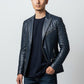 Scarlett Stitch Men's navy blue faux leather blazer jacket with silver stud accents on lapels and shoulders. Features zippered pockets and single-button closure.