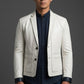 Man wearing a Scarlett Stitch off-white leather blazer with a two-button closure and tailored fit over a dark shirt.