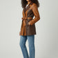 Scarlett Stitch colorblock faux leather trench coat in brown and tan with a belted waist and notched lapel.