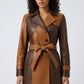 Scarlett Stitch two-tone tan and brown leather trench coat with belted waist and notched lapel.