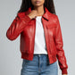 Scarlett Stitch women's red faux leather bomber jacket with ribbed collar, cuffs, and hem. Features zip front and flap pockets.