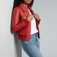 Scarlett Stitch women's red faux leather bomber jacket with ribbed collar, cuffs, and hem. Features chest flap pockets and side welt pockets.