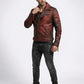 Scarlett Stitch Men's distressed red faux leather moto jacket with asymmetrical zip, notched lapel, and ribbed detailing.