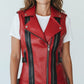 Scarlett Stitch women's red faux leather moto vest with black accents, buckle details, and notched lapel.