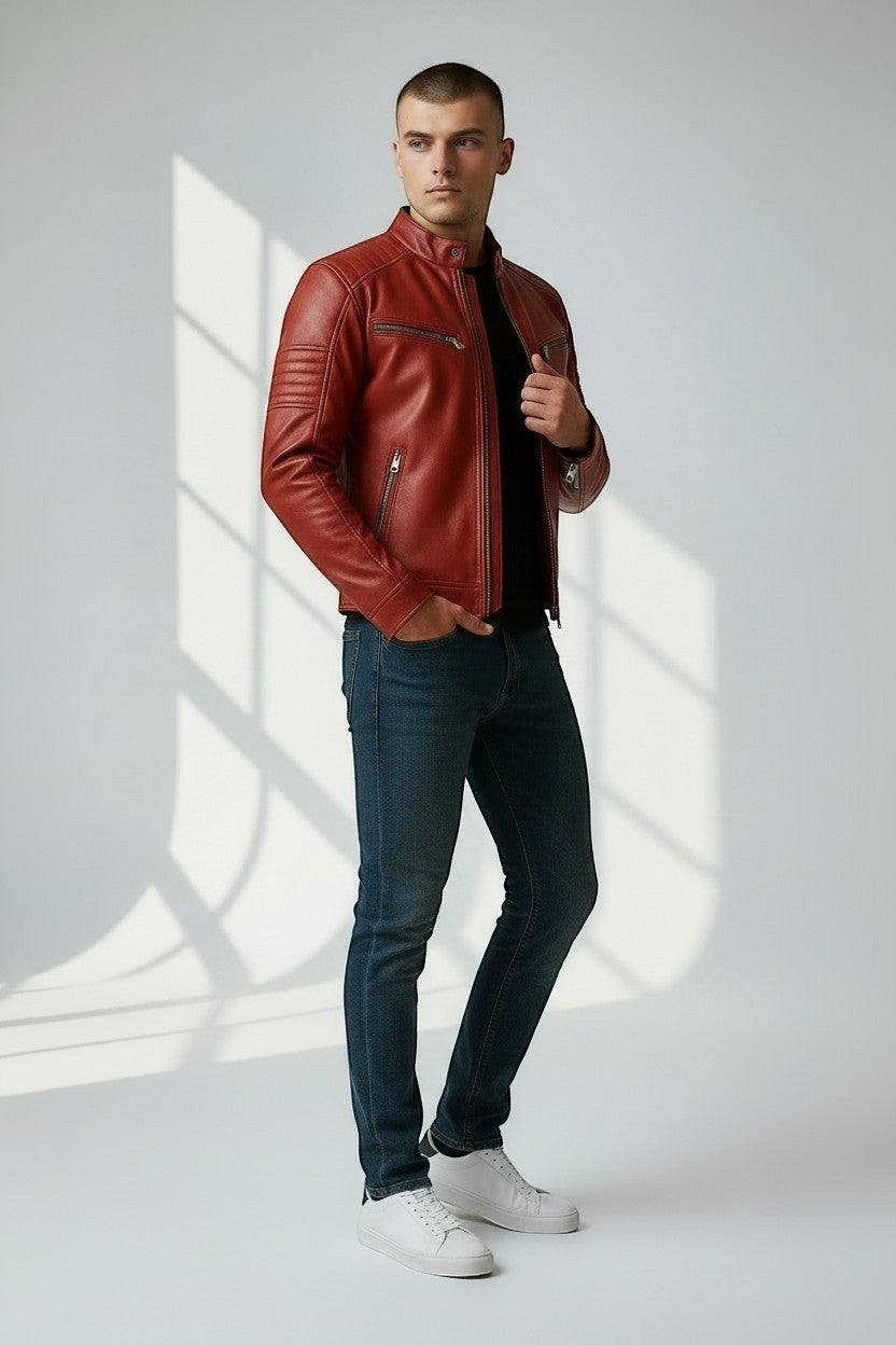 Model wearing a red Scarlett Stitch leather biker jacket with quilted shoulders, metal zippers, and cafe racer collar.
