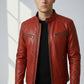 Man wearing a Scarlett Stitch red leather biker jacket with quilted shoulders, metal zippers, and cafe racer collar.