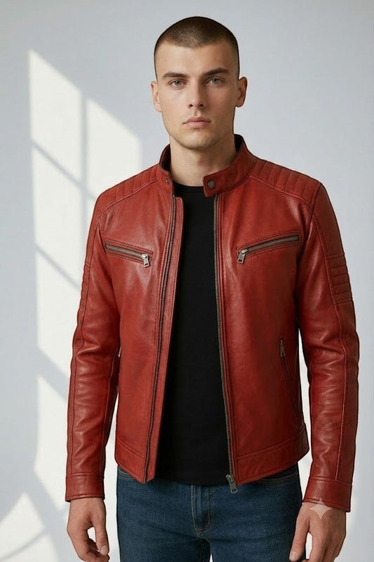 Man wearing a Scarlett Stitch red leather biker jacket with quilted shoulders, metal zippers, and cafe racer collar.