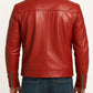 Back view of a man wearing a Scarlett Stitch red real leather biker jacket with zippered cuffs and a tailored fit.