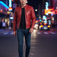 Scarlett Stitch red leather biker jacket with quilted shoulders and metal zippers worn by a man on a city street.