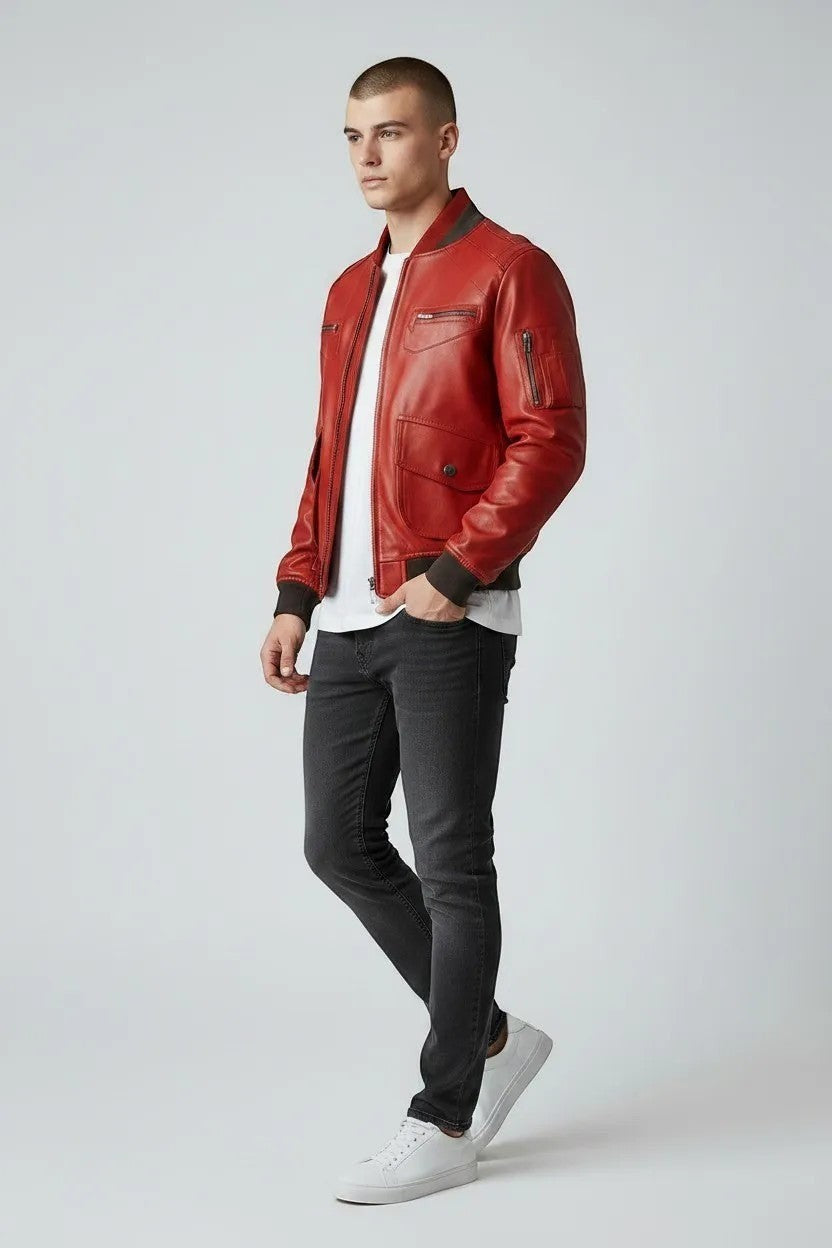 Scarlett Stitch men's red leather bomber jacket with ribbed collar, cuffs, and zippered pockets.