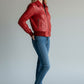 Scarlett Stitch women's red leather bomber jacket with zip front, folded collar, and ribbed cuffs and hem.