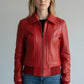 Scarlett Stitch women's red leather bomber jacket with zip-front, folded collar, and ribbed cuffs and hem.