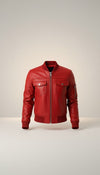 Scarlett Stitch red leather bomber jacket with zippered front, chest pockets, and sleeve pocket. Ribbed cuffs, collar, and hem.