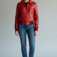 Scarlett Stitch women's red leather bomber jacket with zip front, folded collar, and ribbed cuffs and hem.