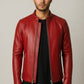 Scarlett Stitch Men's red faux leather motorcycle jacket with stand-up collar and zippered pockets.
