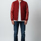 Scarlett Stitch deep red wool-blend varsity bomber jacket with matching red leather sleeves, snap front, and ribbed trim.