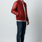 Scarlett Stitch men's deep red wool-blend varsity bomber jacket with matching red leather sleeves, snap front, and ribbed trim.