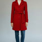 Scarlett Stitch red wool-blend coat with notched lapel, belted waist, and button front. Timeless style for chilly days.
