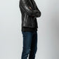 Scarlett Stitch black leather motorcycle jacket for men with silver studs. Features lapel collar, zip closure, zippered cuffs.