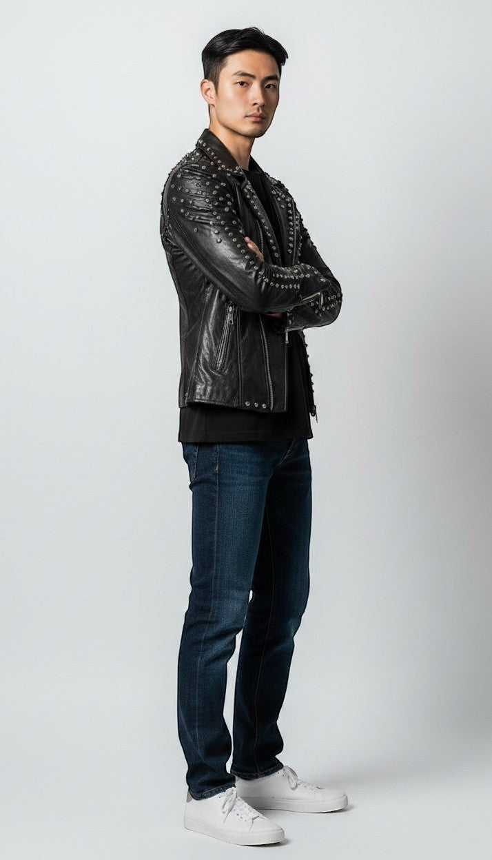 Scarlett Stitch black leather motorcycle jacket for men with silver studs. Features lapel collar, zip closure, zippered cuffs.