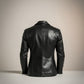 Scarlett Stitch black leather motorcycle jacket for men with silver-toned stud detailing on shoulders and sleeves.