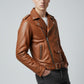 Scarlett Stitch tan leather biker jacket with asymmetrical zip, notched lapels, and belt on a male model