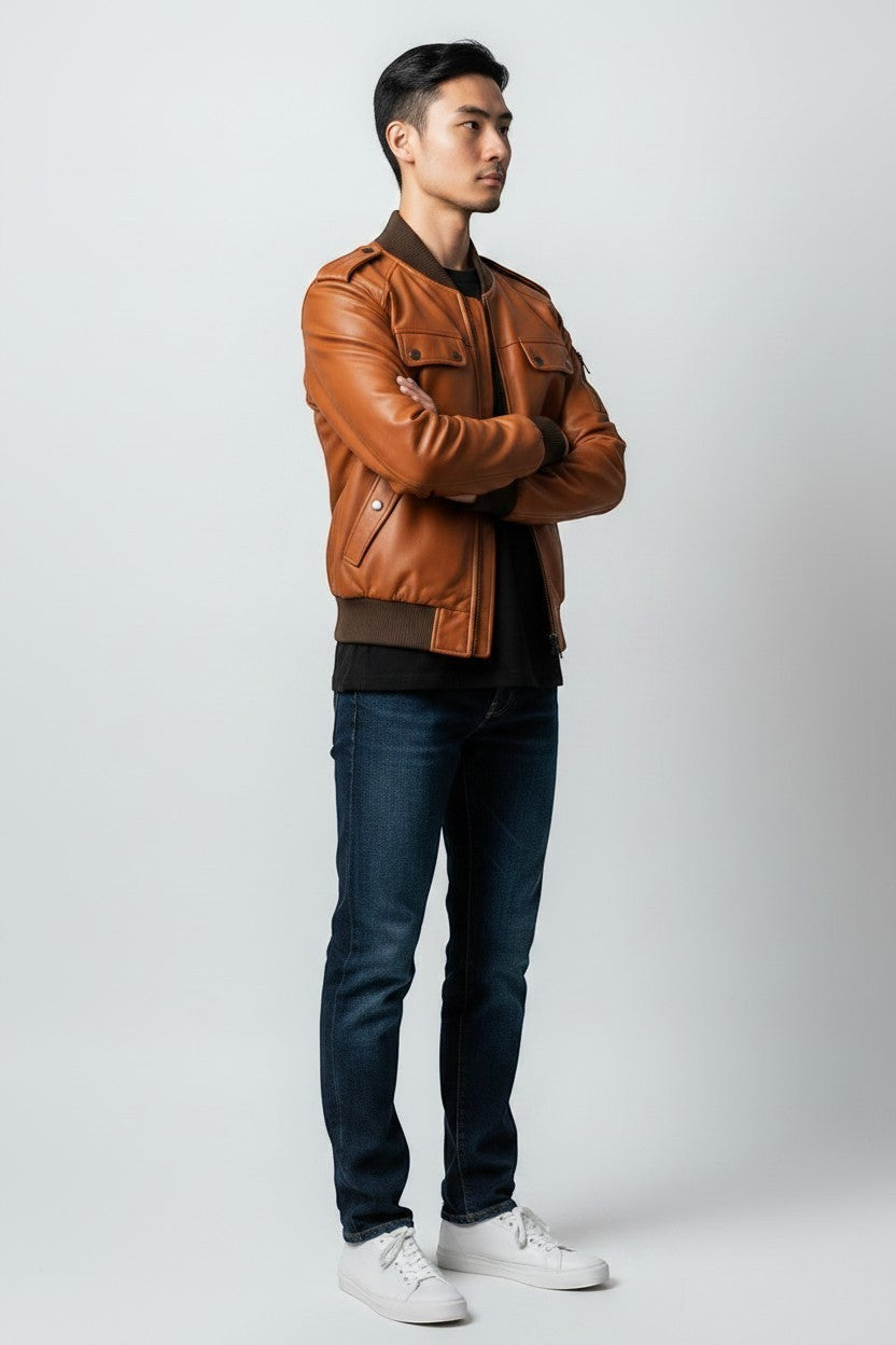 Scarlett Stitch men's tan genuine leather bomber jacket with ribbed collar, cuffs, hem, and epaulet details.