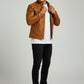 Scarlett Stitch tan leather cafe racer jacket on a man wearing a white t-shirt, black jeans, and white sneakers.