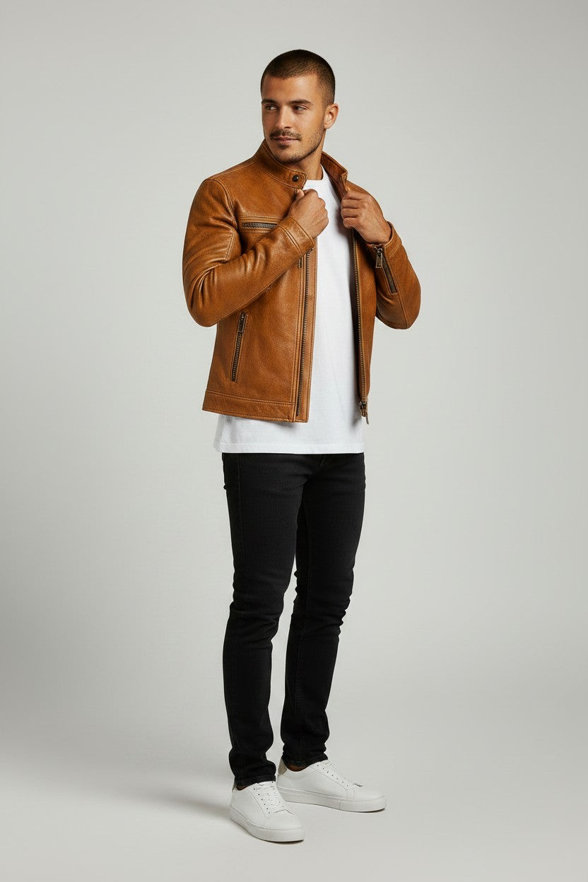 Scarlett Stitch tan leather cafe racer jacket on a man wearing a white t-shirt, black jeans, and white sneakers.
