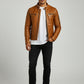Scarlett Stitch men's tan leather cafe racer jacket with zippered pockets and snap collar worn over a white t-shirt