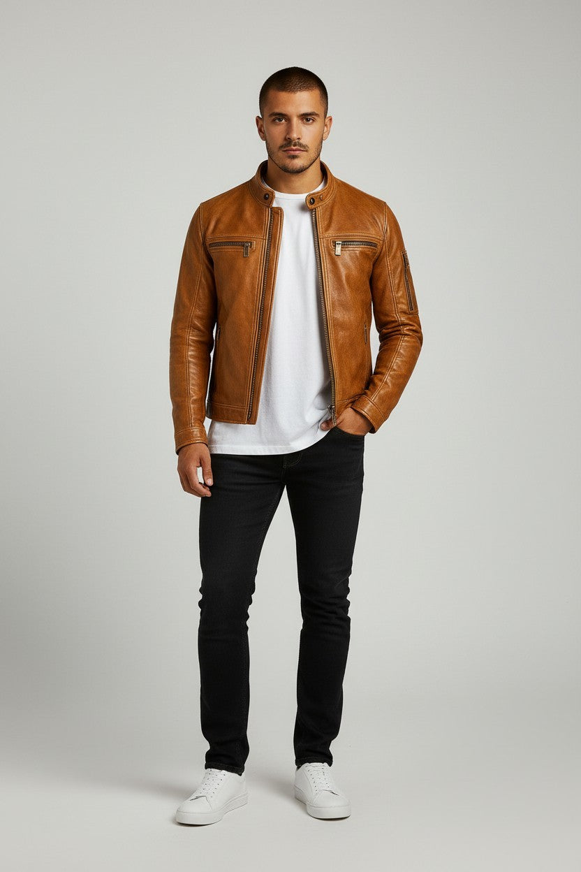 Scarlett Stitch men's tan leather cafe racer jacket with zippered pockets and snap collar worn over a white t-shirt